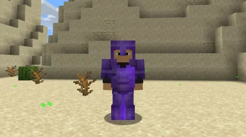 A player wearing fully enchanted netherite armor standing in a desert.